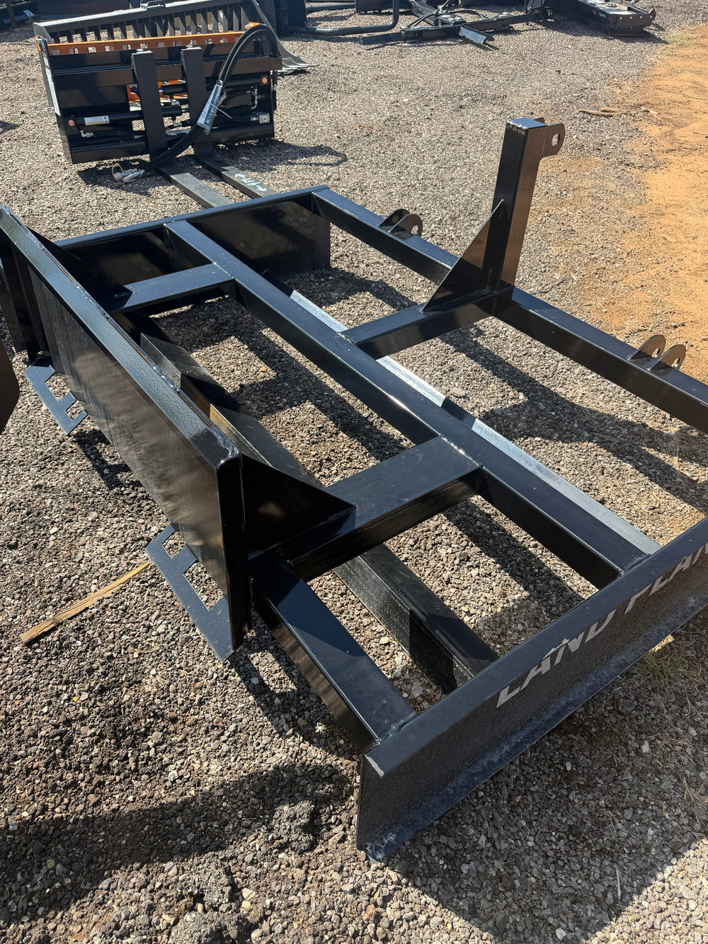 Land plane leveler frame and top link mast